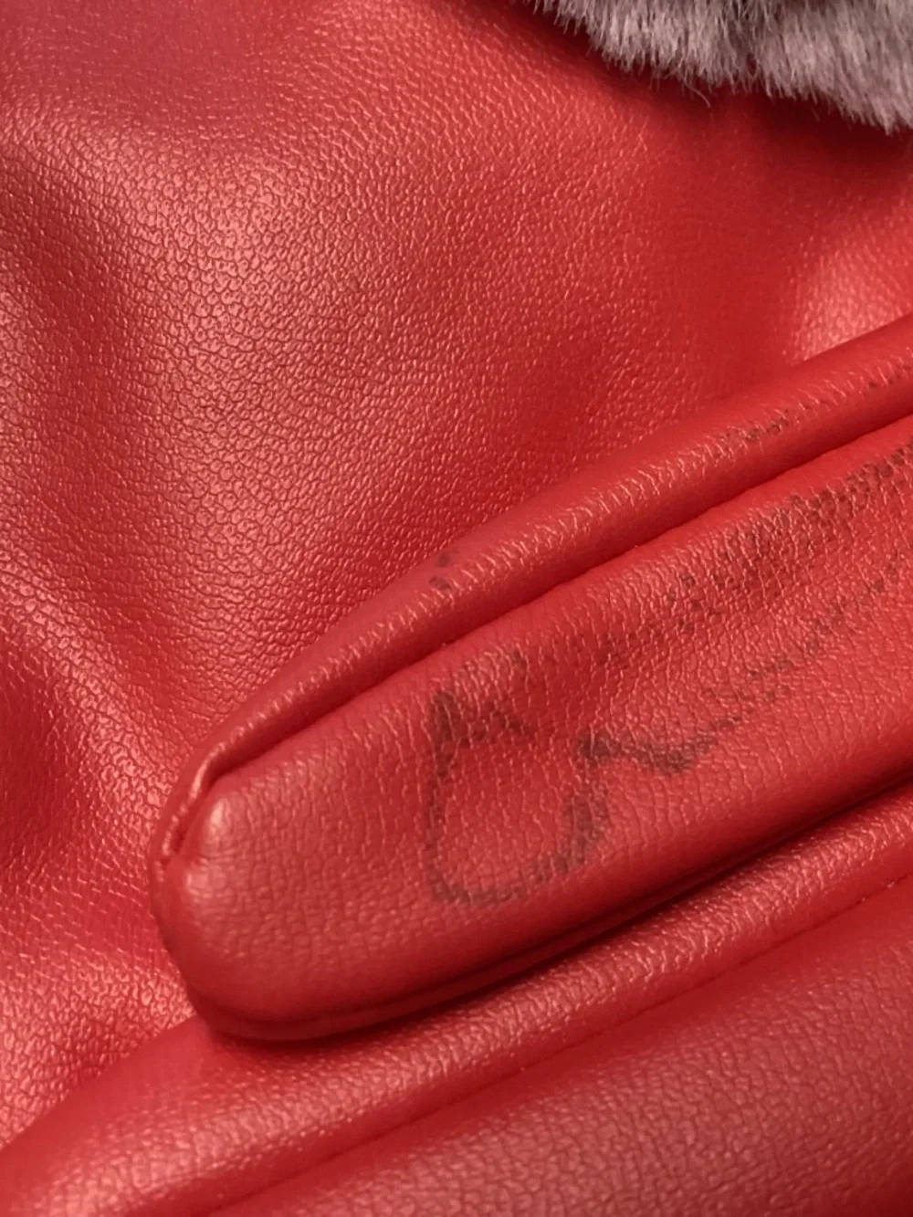 Red winter gloves with PURPLE FAUX FUR. really cute. Non leather
